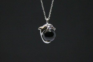 White gold dolphin pendant with onyx