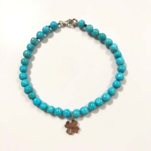 Turquoise bracelet with four-leaf clover pendant